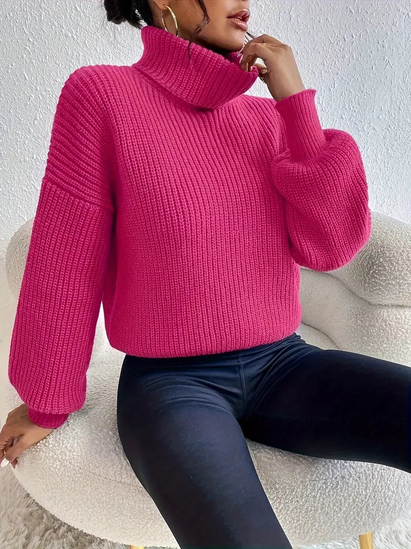 Maglia chic con spalle scese, maniche a lanterna e collo a rollino
