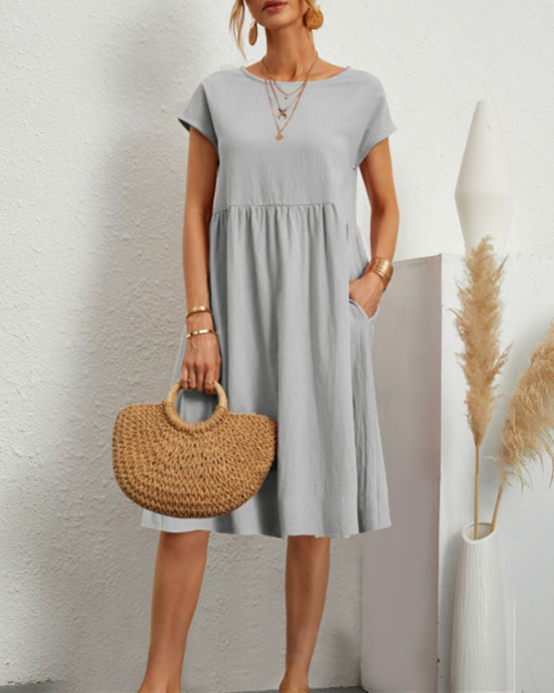 Comodo abito midi con scollo tondo e tasche