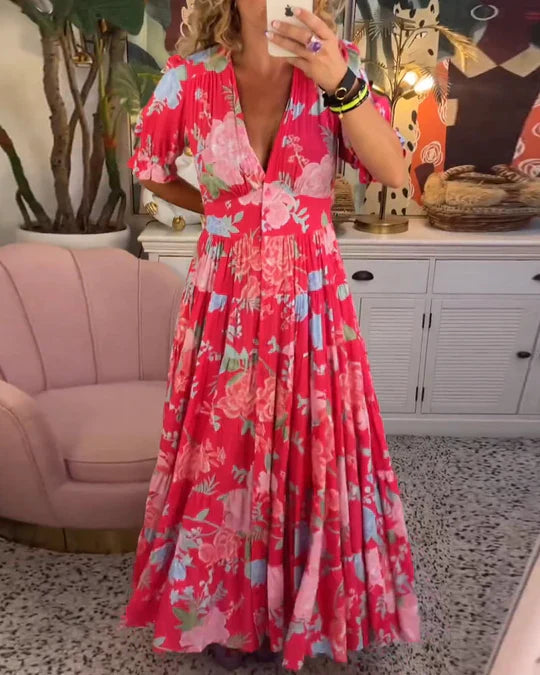 Maxi abito estivo: profondo scollo a V, orlo a balze