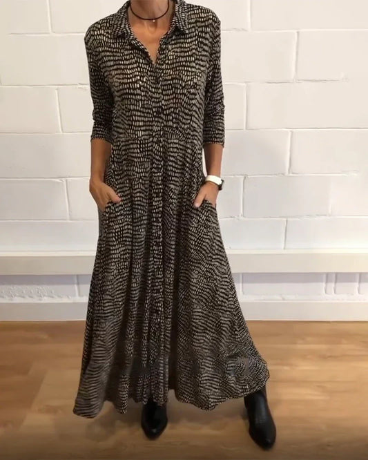 Eleanora - elegante abito lungo a trapezio con tasche e dettagli abbottonati